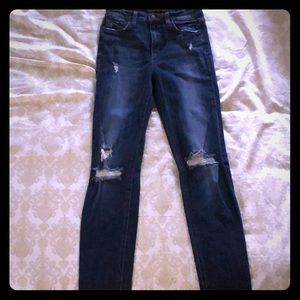 High waisted, dark, distressed jeans